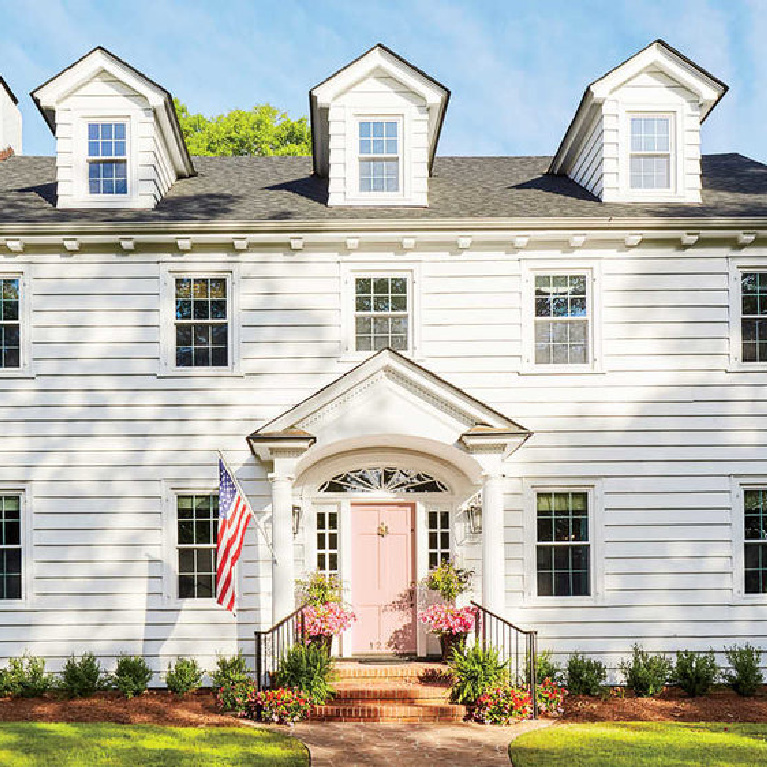Beautiful traditional house exterior painted Benjamin Moore Chantilly Lace - Gathered Group. #benjaminmoore #chantillylace #whitepaint #paintcolors #exteriorcolors #houseexteriors