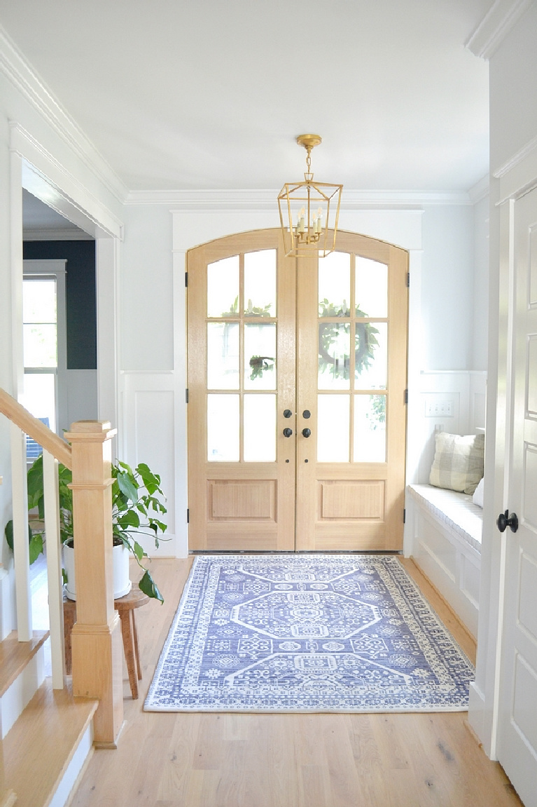 Sherwin Williams Extra White paint on trim in gorgeous modern farmhouse entry - Chrissy Marie Blog. #sherwinwilliams #extrawhite #brightwhitepaint #paintcolors #whitepaint #bestwhites #interiordesign