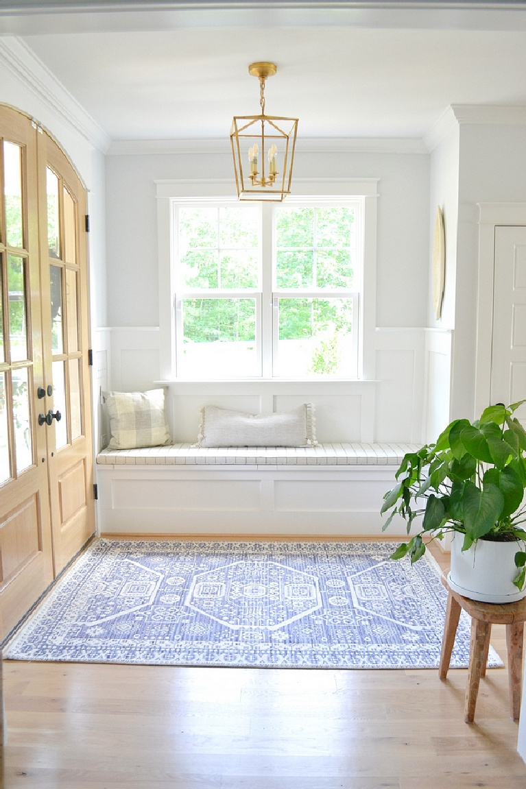 Sherwin Williams Extra White paint on trim in gorgeous modern farmhouse entry - Chrissy Marie Blog. #sherwinwilliams #extrawhite #brightwhitepaint #paintcolors #whitepaint #bestwhites #interiordesign