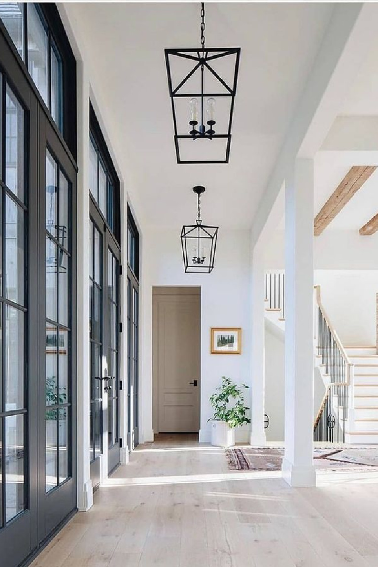 Pure White (Sherwin Williams) bright white paint color in a beautiful modern farmhouse hall - Kate Marker. #sherwinwilliamspurewhite #paintcolors #bestwhites #interiordesign