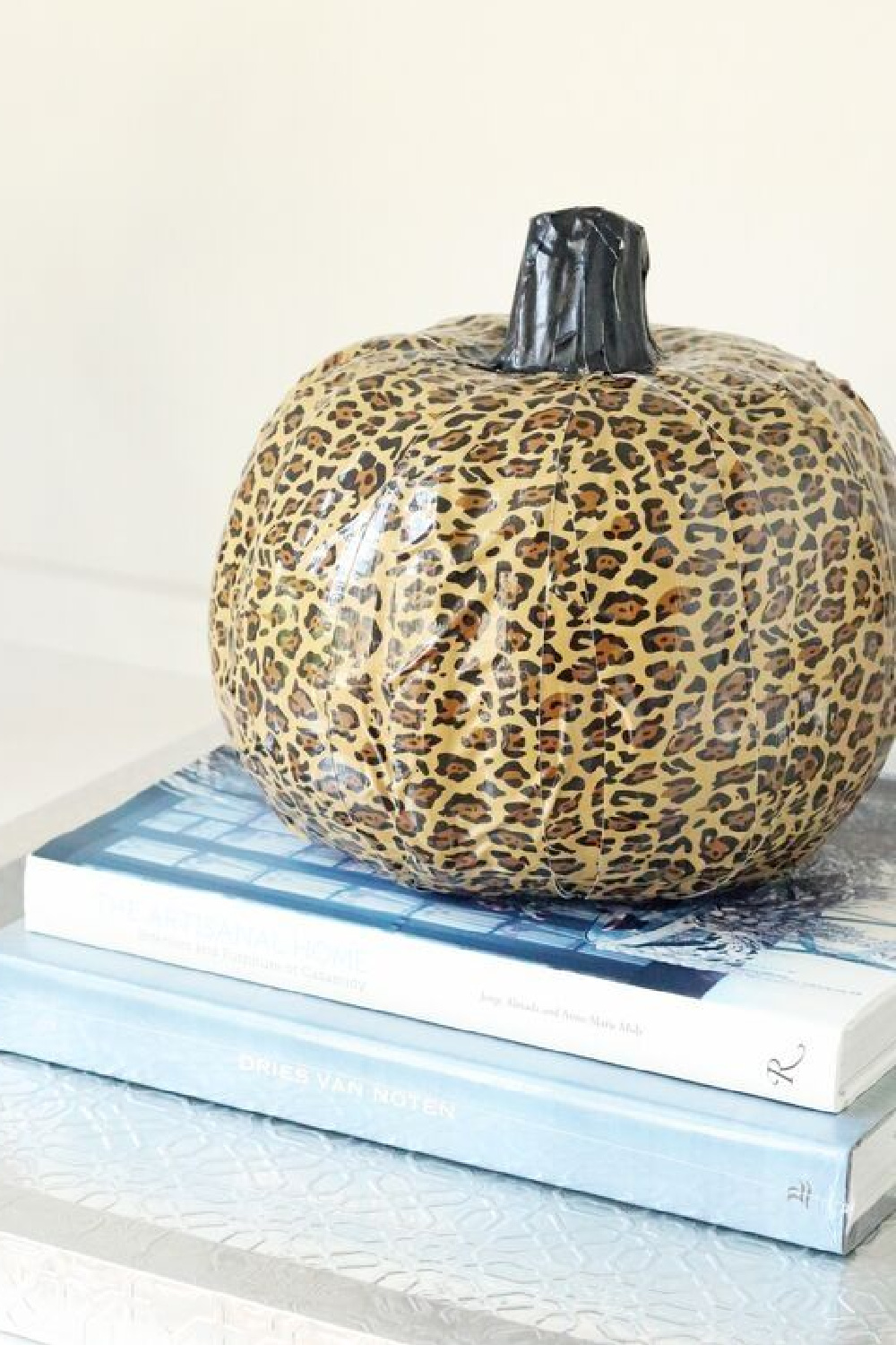 Leopard pumpkin DIY craft with duct tape - Passion for Savings. #fallcrafts #leopard #pumpkincraft #diy