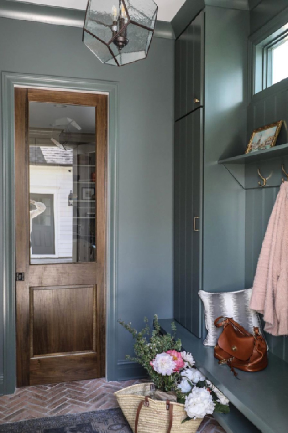 Farrow & Ball Green Smoke on walls and built-ins of a mud room by Park and Oak. #greensmoke #farrowandballgreensmoke #greenpaintcolors