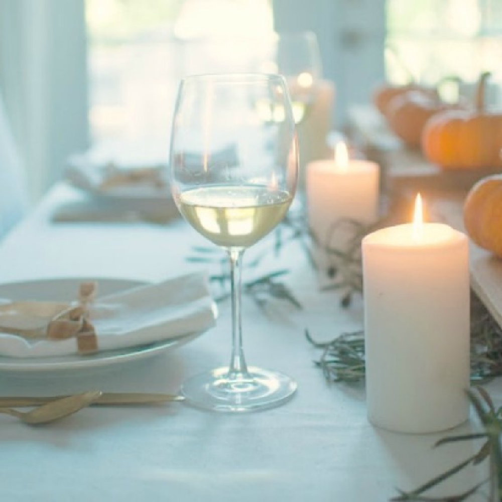 Simple lovely fall table Thanksiving tablescape idea with long wood board and mini pumpkins - Gwen Moss. #falltable #tabledecor #thanksgiving #tablescape