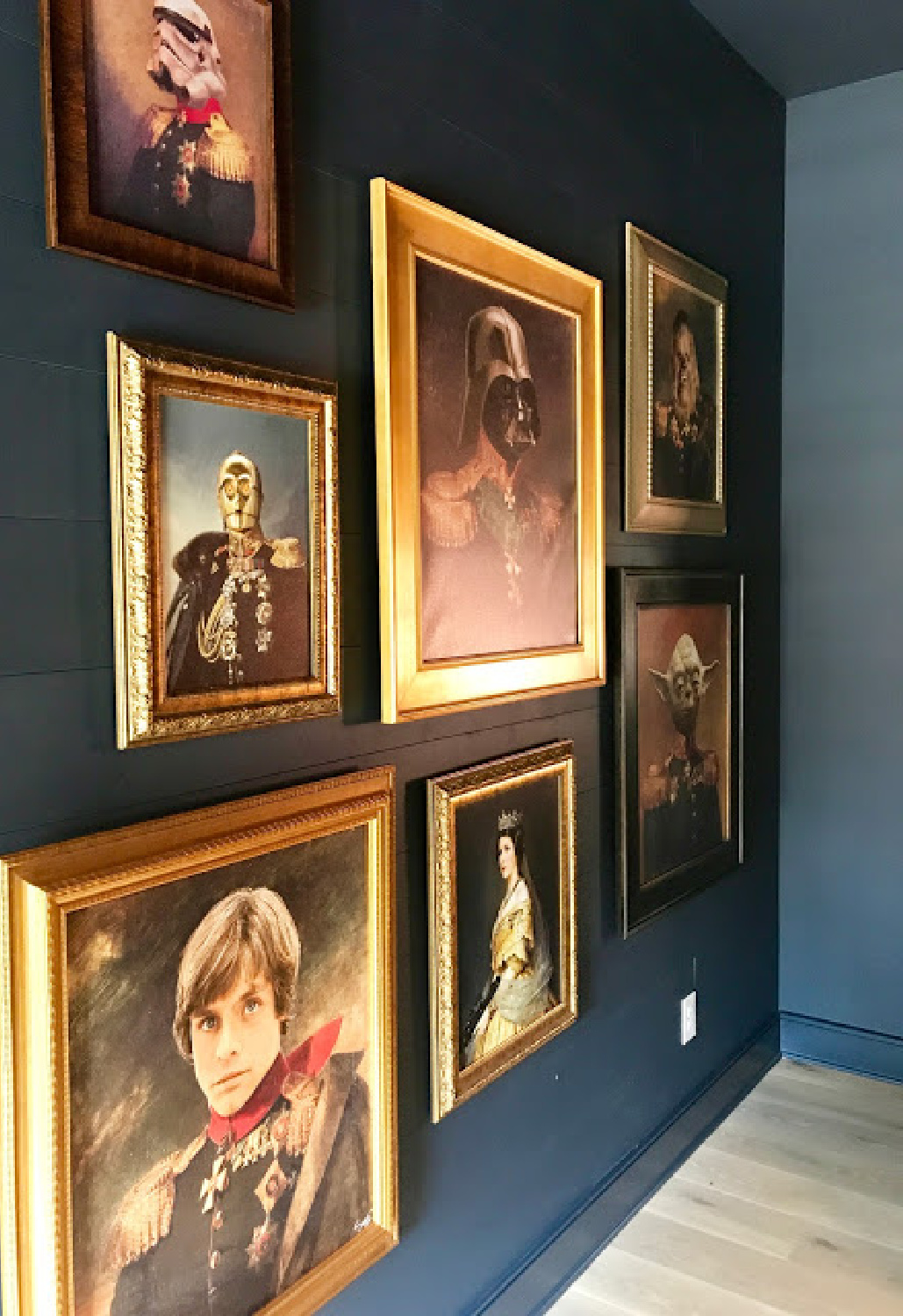 Hilarious Star Wars characters sit for oil paintings displayed on a gallery wall in a fun bedroom by Dana Lynch at the Pinewood Forest Idea House. Photo: Sherry Hart. #starwars #oilpaintings #whimsicaldecor #humor #artgallerywall #tealwalls #pineforestideahouse #atlantashowhouse