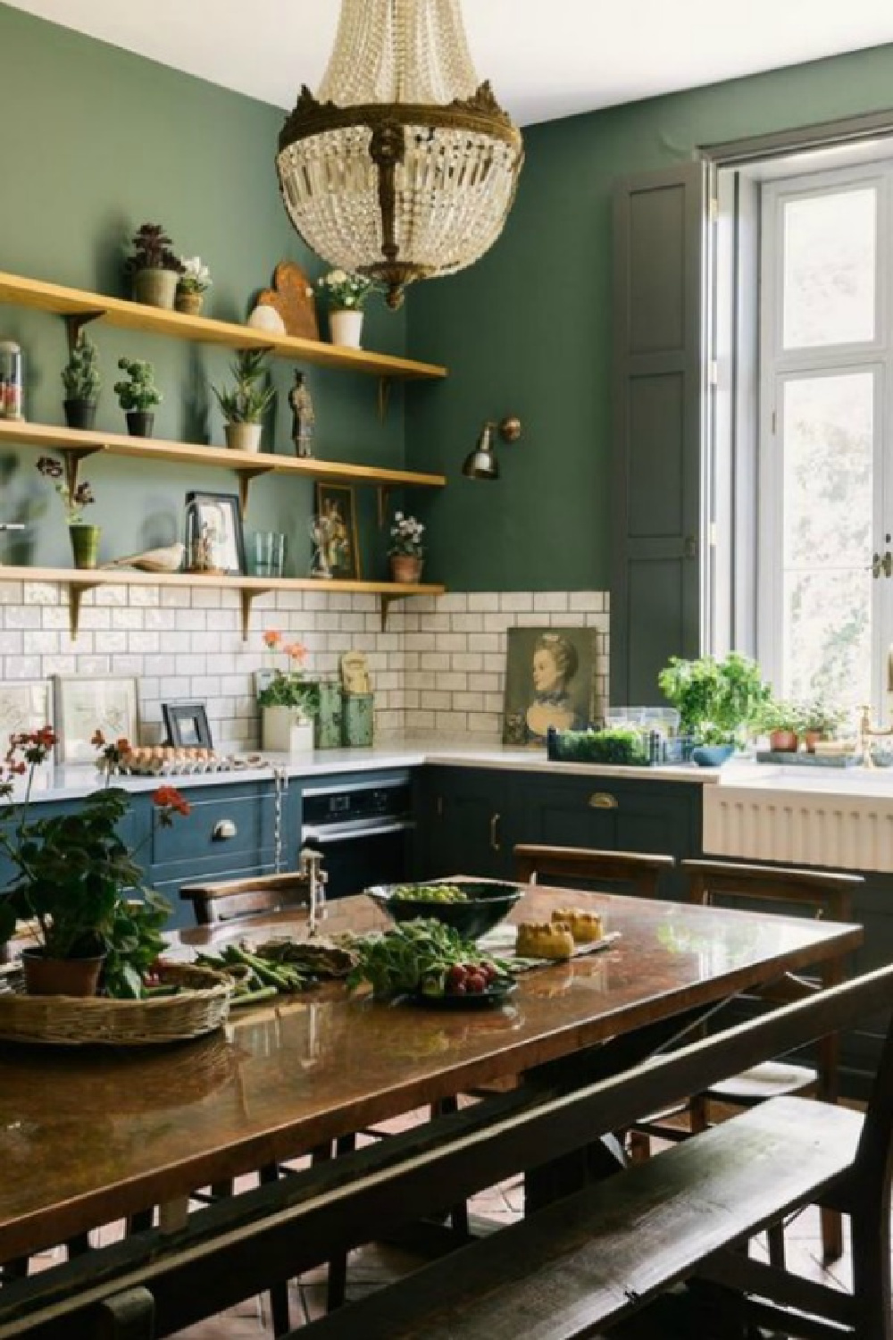 Gorgeous deep green walls in a bespoke farmhouse kitchen by deVOL kitchens - paint color is Ho Ho Green by Little Greene. #deVOLkitchens #englishcountry #greenkitchen #kitchendesign #darkgreenpaint