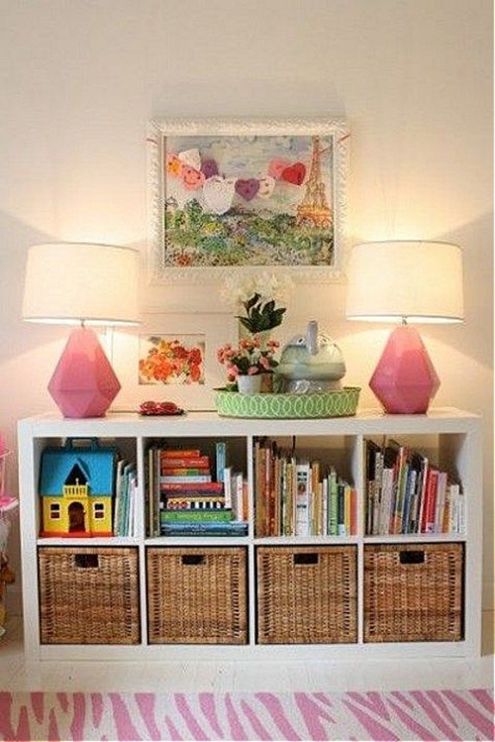 Horizontal storage in a play room with pink lamps and Kallax from Ikea. #kallaxhack