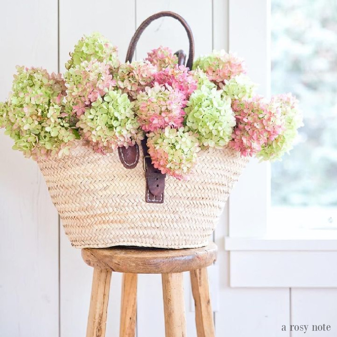 Beautiful French farmhouse moment with market basket full of dried hydrangea in fall - A Rosy Note. #fallflorals #driedhyrdrangea #frenchfarmhouse #marketbasket