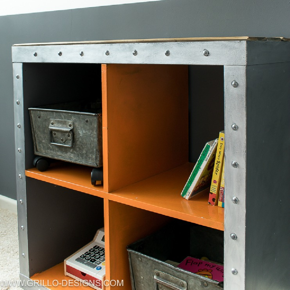 Kallax hack with metal industrial rivet strips for an orderly storage solution in a bedroom. #kallaxhack