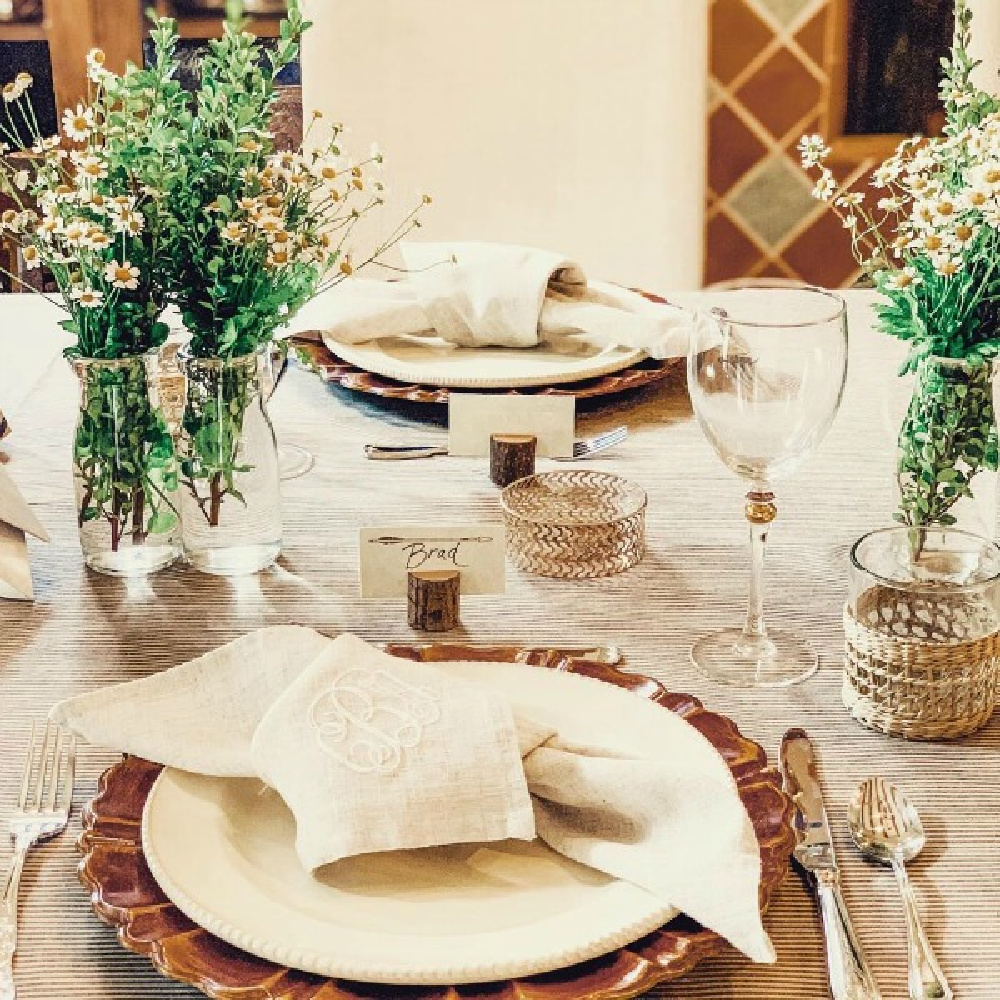 Breathtaking, rustic elegance with countless custom details and design by After Orange County at this outdoor wedding reception with unique tablescape decor! #weddings #tablescape #rusticelegance #outdoorwedding #placesetting #jutenapkins