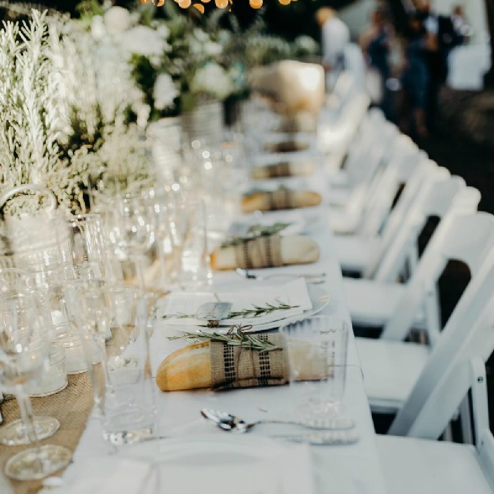 Breathtaking, rustic elegance with countless custom details and design by After Orange County at this outdoor wedding reception with unique tablescape decor! #weddings #tablescape #rusticelegance #outdoorwedding #placesetting #jutenapkins