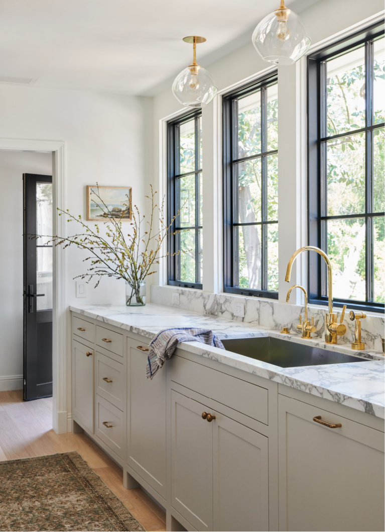 Beautiful custom kitchen by AmberInteriors with putty kitchen cabinets. #kitchendesign #puttycabinets #puttypaintcolor #mushroompaintcolor