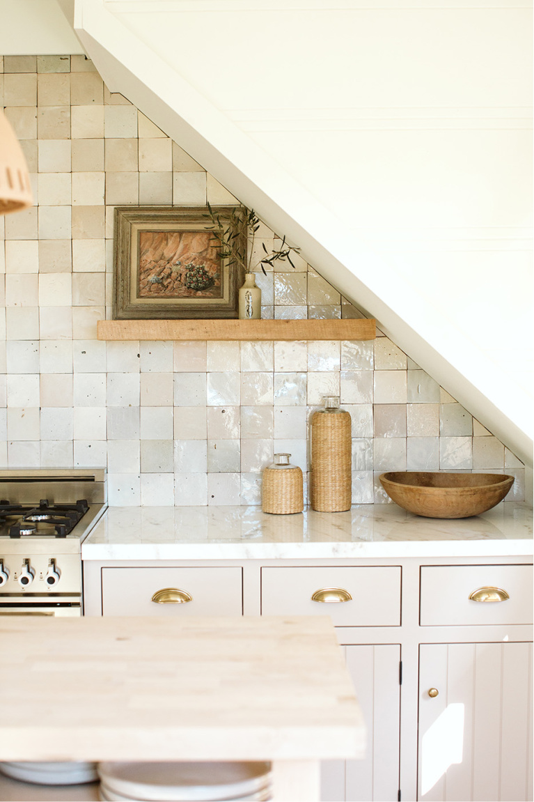 Gorgeous neutral timeless kitchen with putty colored cabinets and Zellige backsplash tile - Bodega House. #kitchendesign #puttycabinets #timelesskitchen #zellige #mushroom