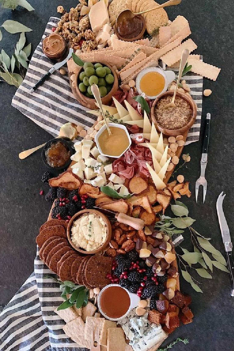 Simple yet elegant Thanksgiving tablescape inspiration with rustic, modern farmhouse, casual chic charm - see more details on Hello Lovely Studio. #tablescapes #thanksgiving #holidaytables #modernfarmhouse #rusticmodern #placesettings