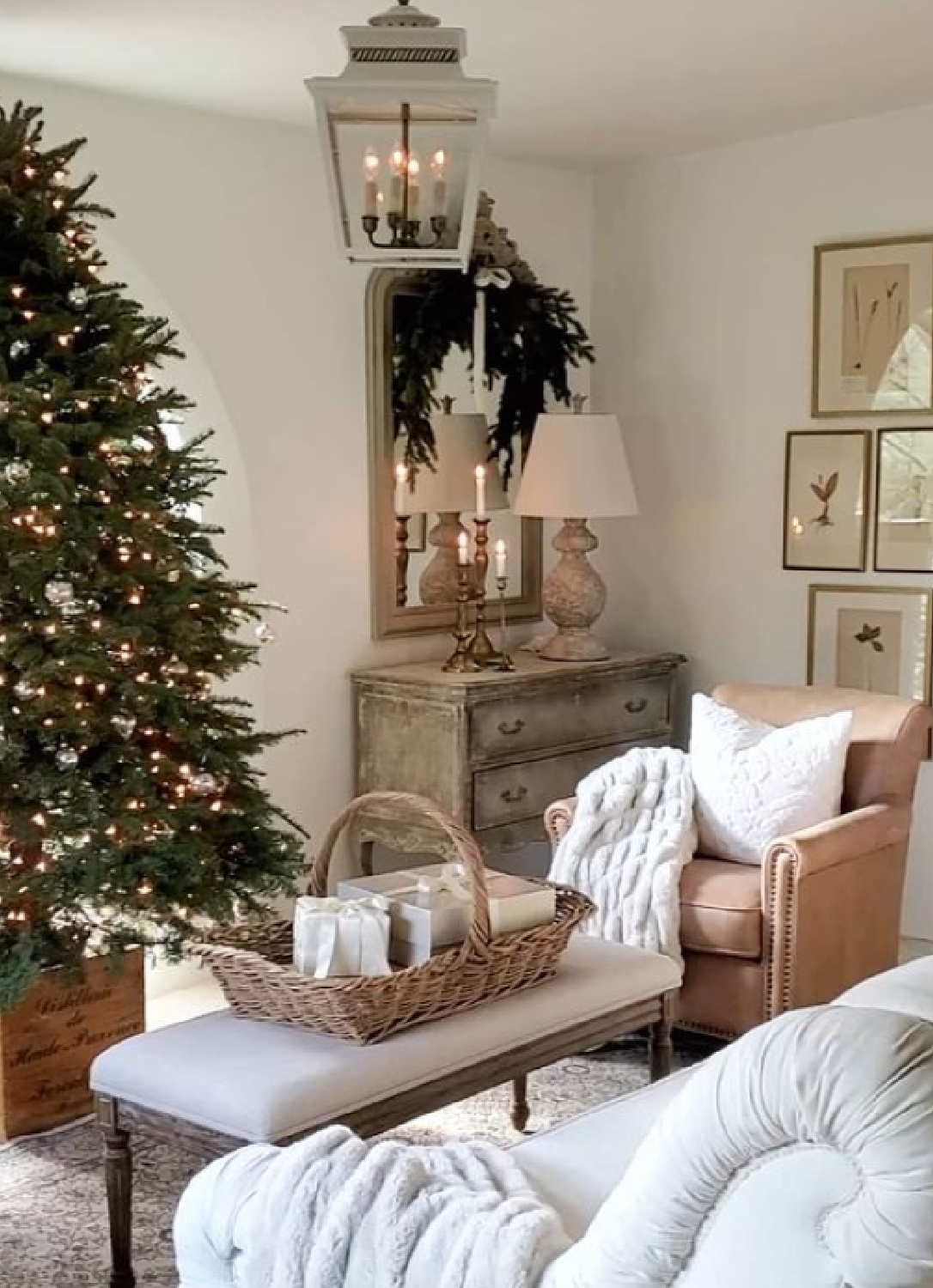 French country Christmas living room with tree, basket, and pale palette - The French Nest Co Interior Design