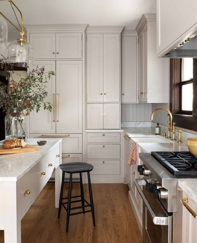 Breathtaking custom kitchen with putty kitchen cabinets - @heidicaillierdesign. #kitchendesign #kitchens #puttycabinets #serenekitchen #customkitchens