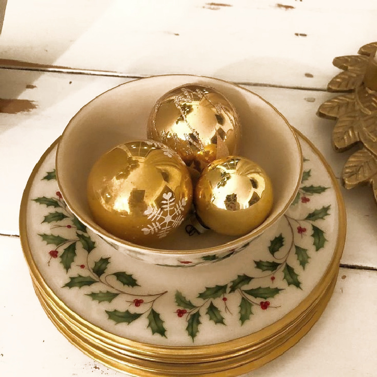 Simple Christmas decor with vintage gold ornaments in Lenox Holly pattern bowl - Hello Lovely Studio.