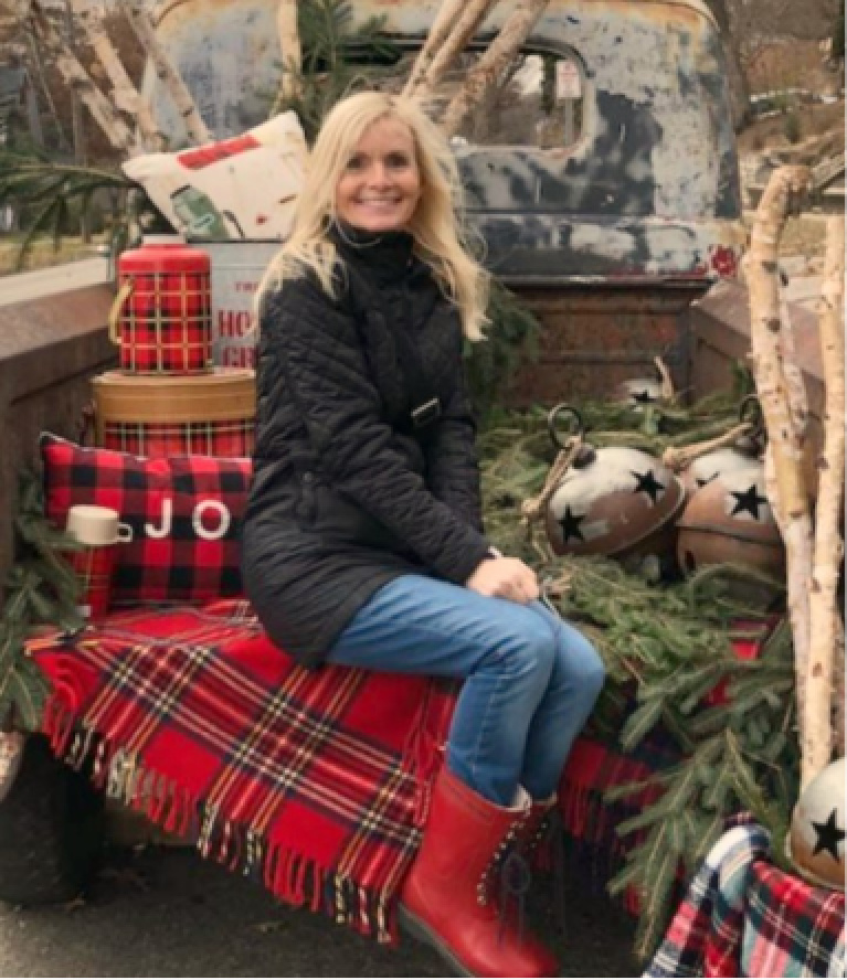 Farmhouse Christmas decor in a pickup with red plaid, vintage, bells, and thermoses at Urban Farmgirl - Hello Lovely Studio. #farmhousechristmas #vintagetruck #holidaydecor #hellolovelystudio