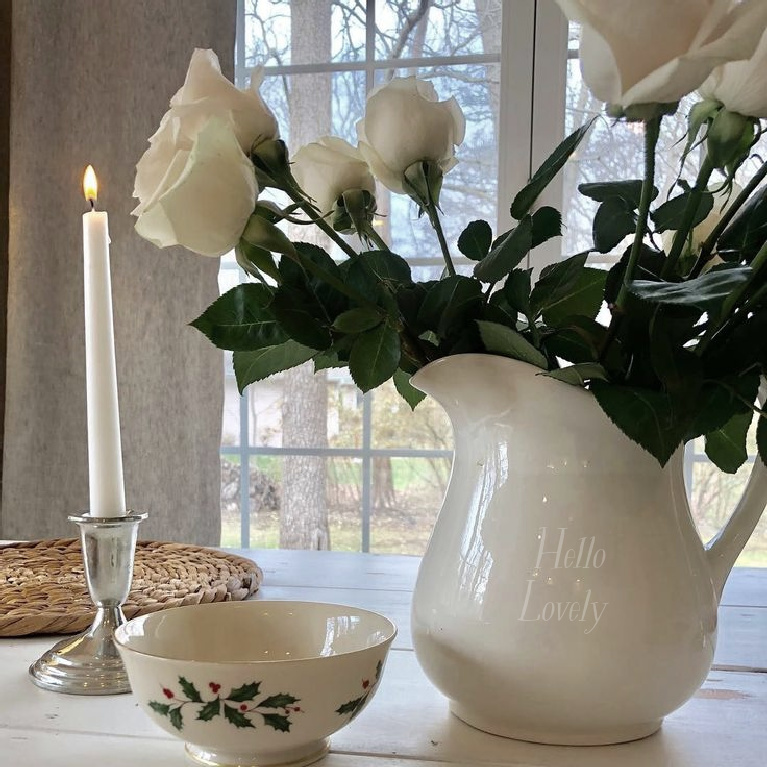 Hello Lovely Studio white Christmas pitcher with roses, Lenox Holly bowl and candle. #holidaydecor #whitechristmas #hellolovelystudio