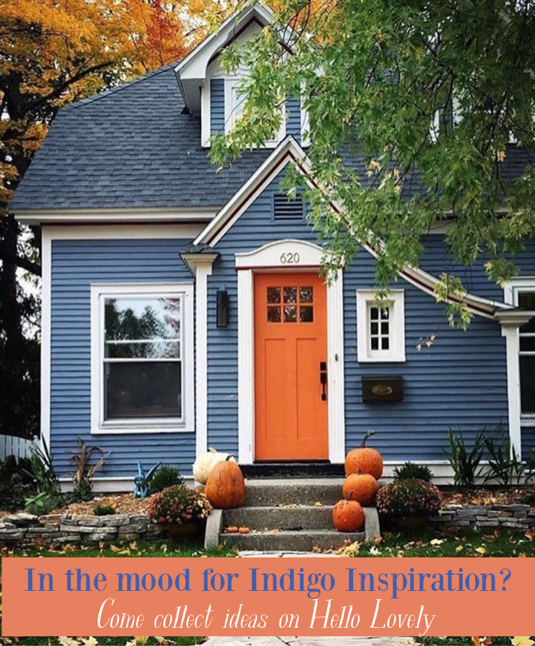 Pretty indigo blue Tudor cottage with orange door and pumpkins on the front steps in fall! Come discover more decor, paint colors, and interiors where indigo blue plays a starring role. #hellolovelystudio #indigoblue #bluedecor #bluepaintcolors #bluehouses #blueinteriors