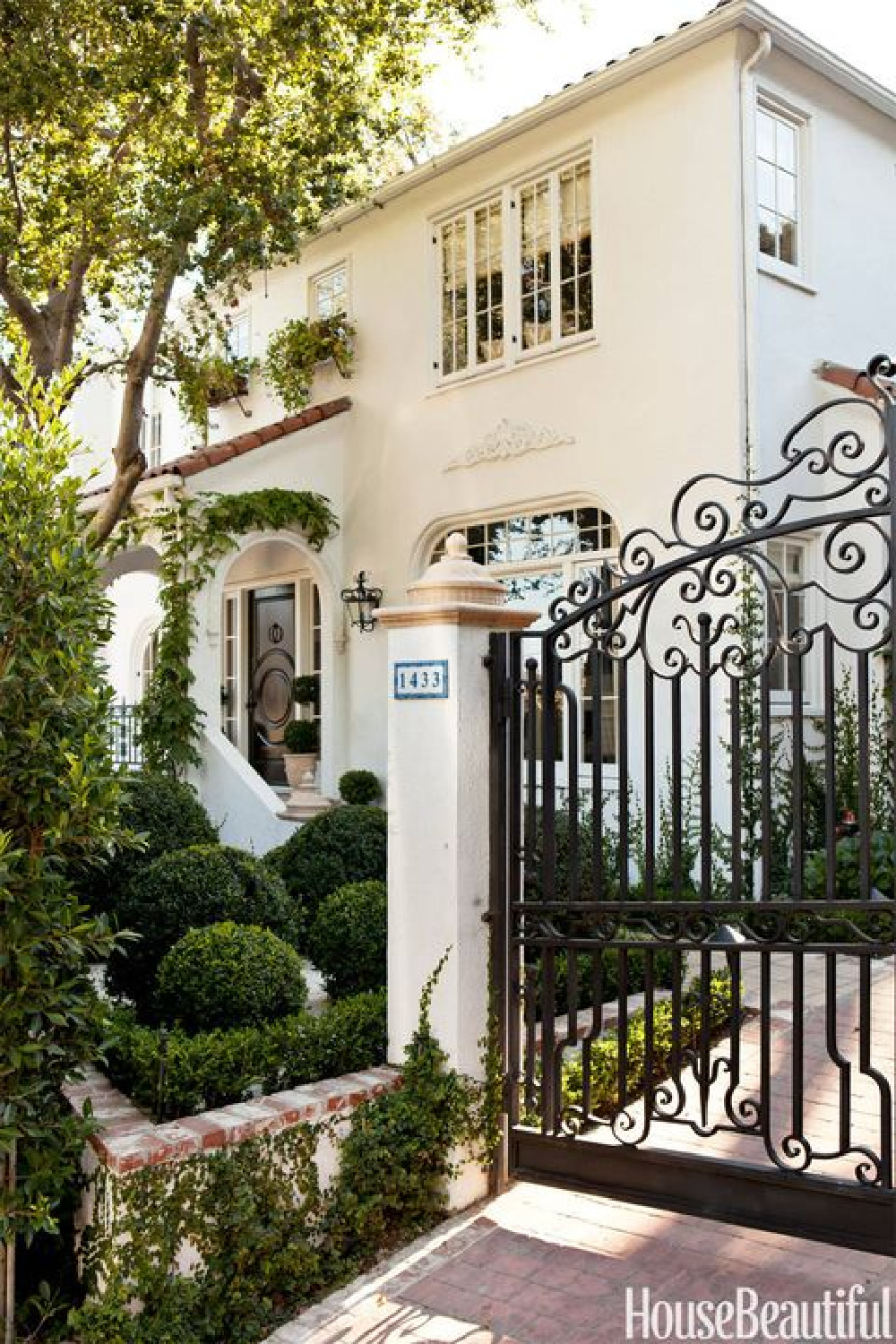 Beautiful Santa Barbara home exterior - Mark Sikes. #whitehouse #housexteriors #wroughtirongate