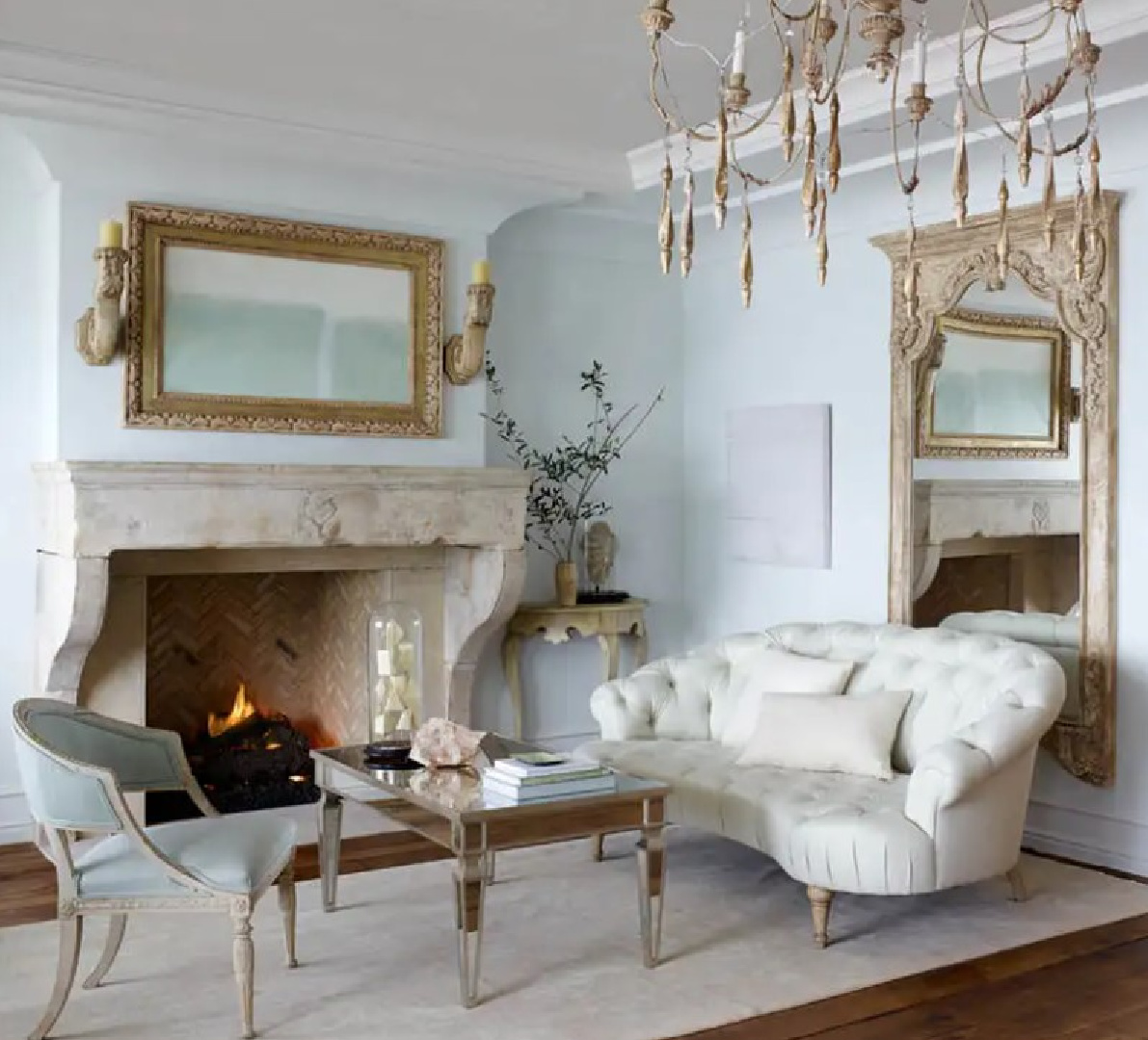 Breathtaking French country living room with stone fireplace and pale blue walls - Ohara Davies Gaetano Interiors. #frenchblue #frenchlivingroom