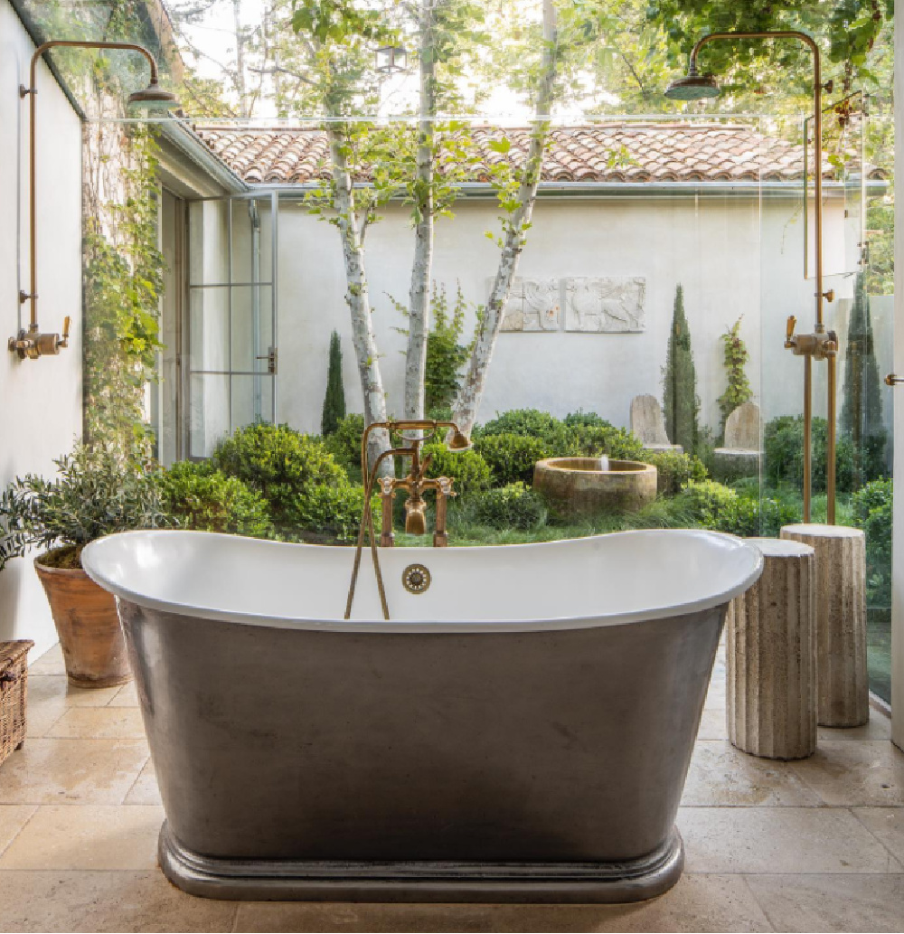 Patina Farm glass bathroom with soaking tub, double shower heads, and a glorious surrounding garden - Brooke Giannetti. #patinafarm #bathroomdesign #soakingtub