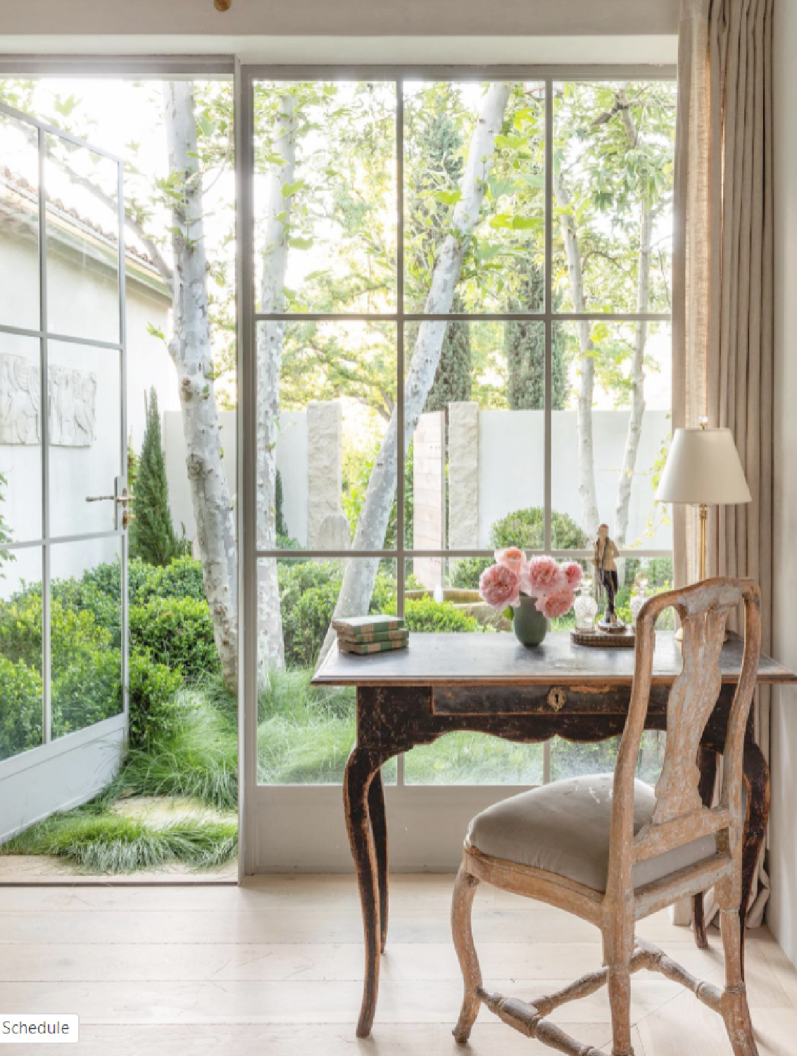 Patina Farm dressing area with steel French doors to garden and Swedish antique table and chair - Brooke Giannetti. #patinafarm #frenchfarmhouse #interiordesign