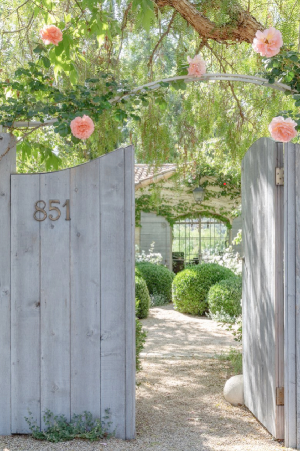 Patina Farm entrance gate rose arbor and home exterior - Brooke Giannetti. #patinafarm #frenchfarmhouse #farmhousegarden