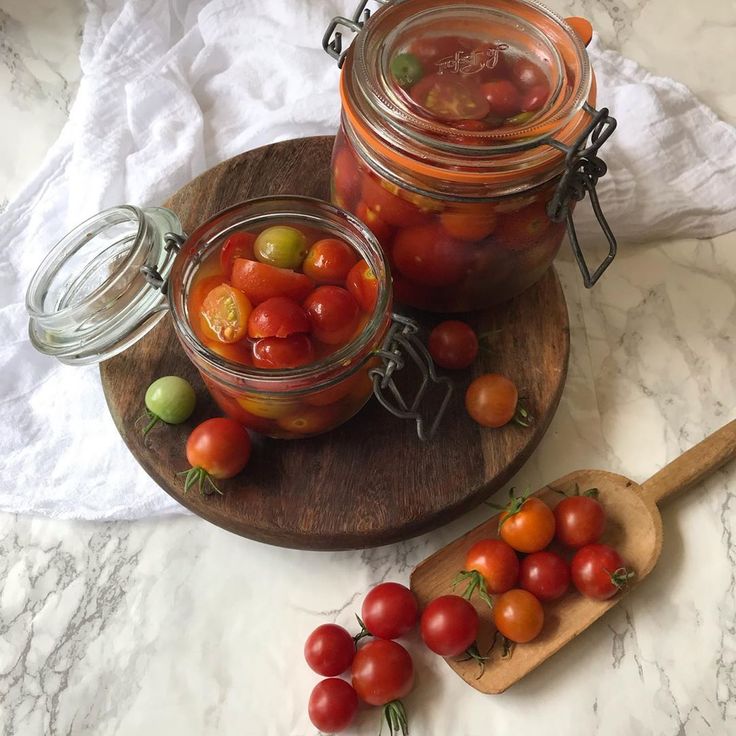 Pickled cherry tomatoes styled artfully by Pinecones and Acorns.