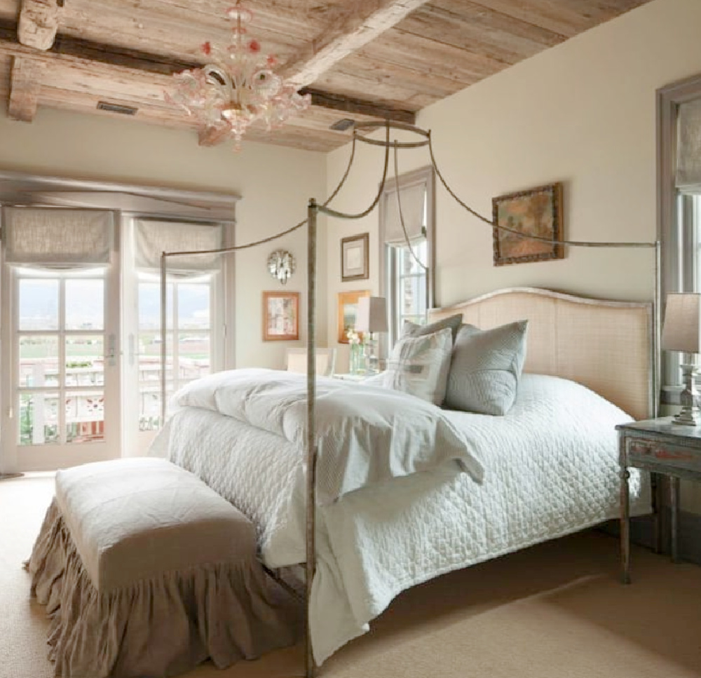 Romantically rustic elegant French country bedroom with raw rugged wood ceiling and poster bed - design by Desiree Ashworth. #frenchcountrybedroom #europeancountry