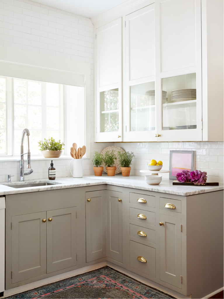 Gorgeous serene custom kitchen with greige base kitchen cabinets and white uppers - Stephanie Krauss Design. #kitchendesign #puttycabinets #greigekitchens #serenekitchen #interiordesign