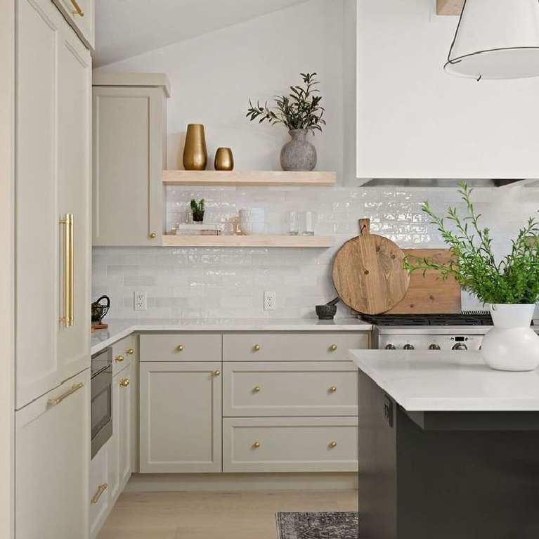 Beautiful kitchen with putty, greige, or mushroom paint color on cabinets - TTMhomedesign. #kitchendesign #putty #modernfarmhouse #openshelves