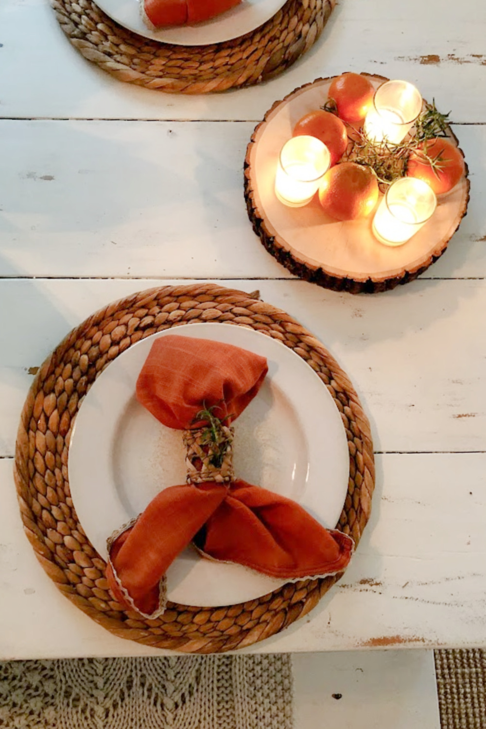 Orange napkins on my white farm table in early fall - Hello Lovely Studio.