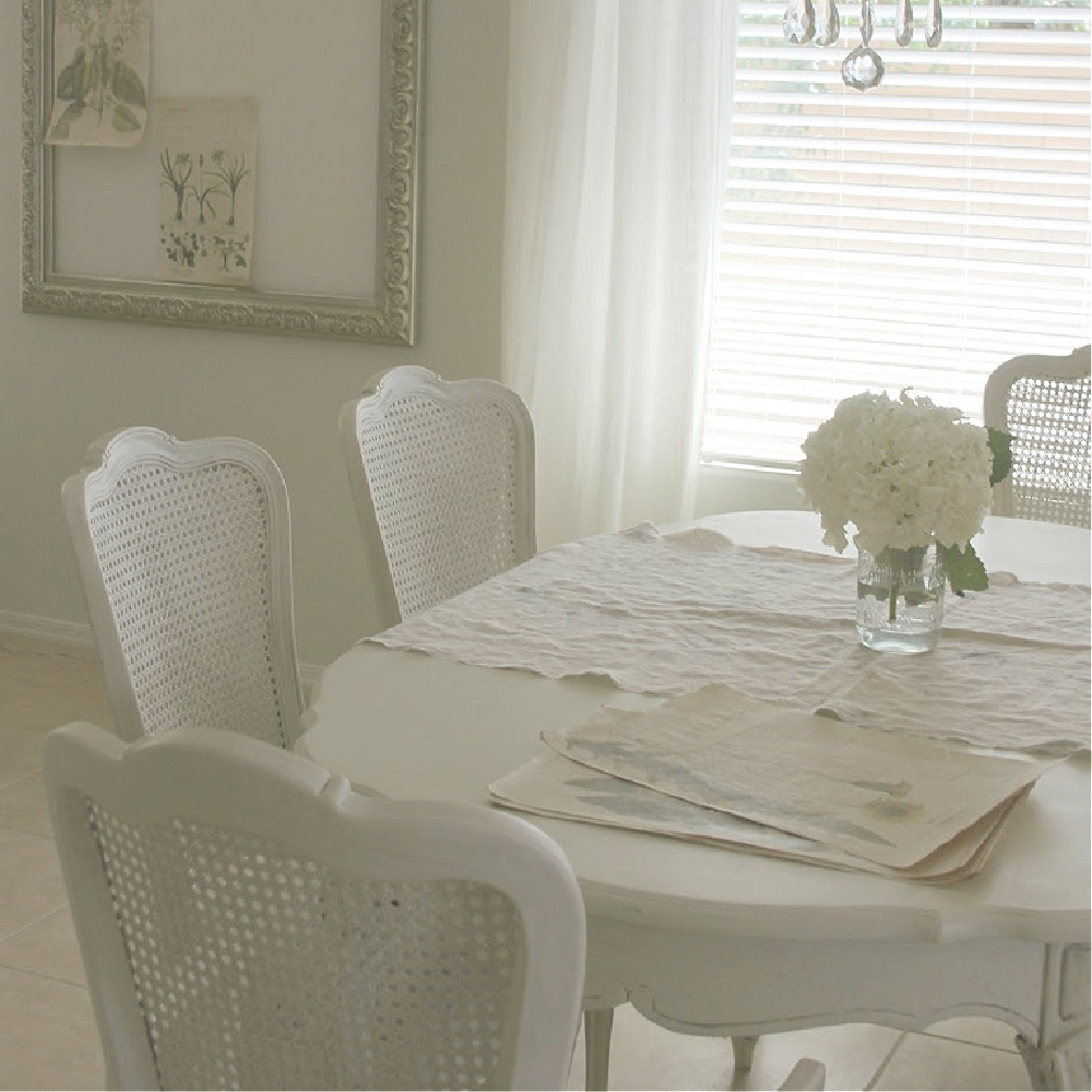 Beautiful serene shabby chic dining room with cane back chairs by Hello Lovely Studio. #diningroom #hellolovelystudio #shabbychic #frenchcountry