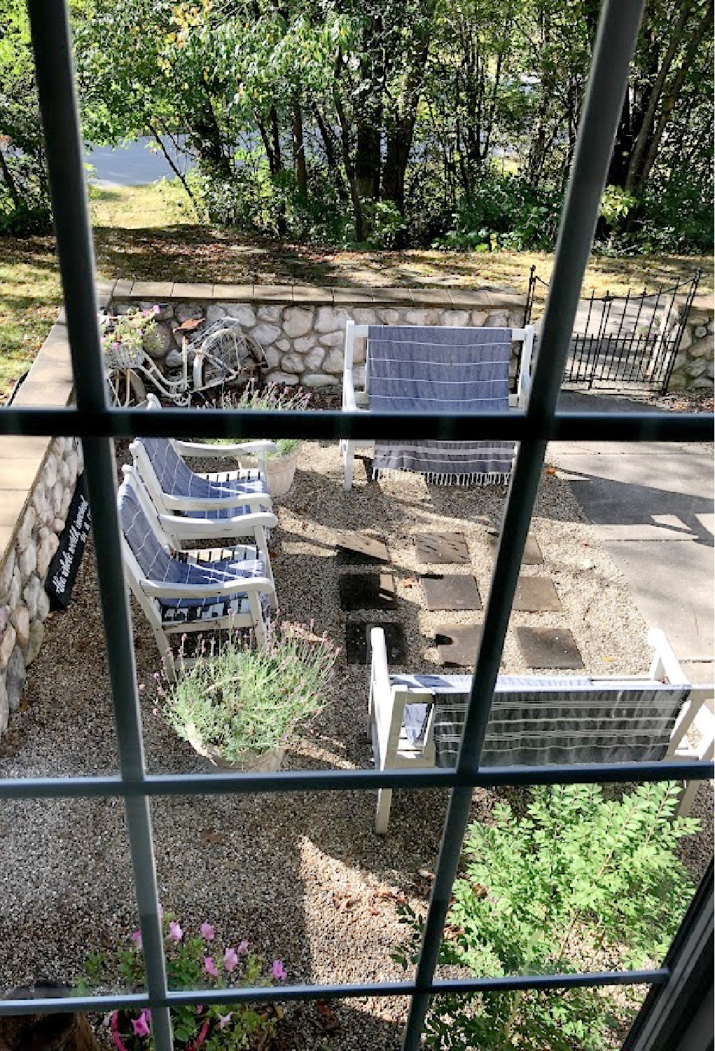 Hello Lovely's courtyard through the window in early fall.