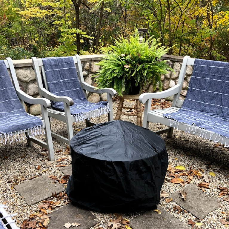 Wood burning fire pit in our French country courtyard with pea gravel is the perfect little addition to enjoy roasted marshmallows and family time. #firepit #woodburningfirepit #outdoordecor #patiodecor #hellolovelystudio