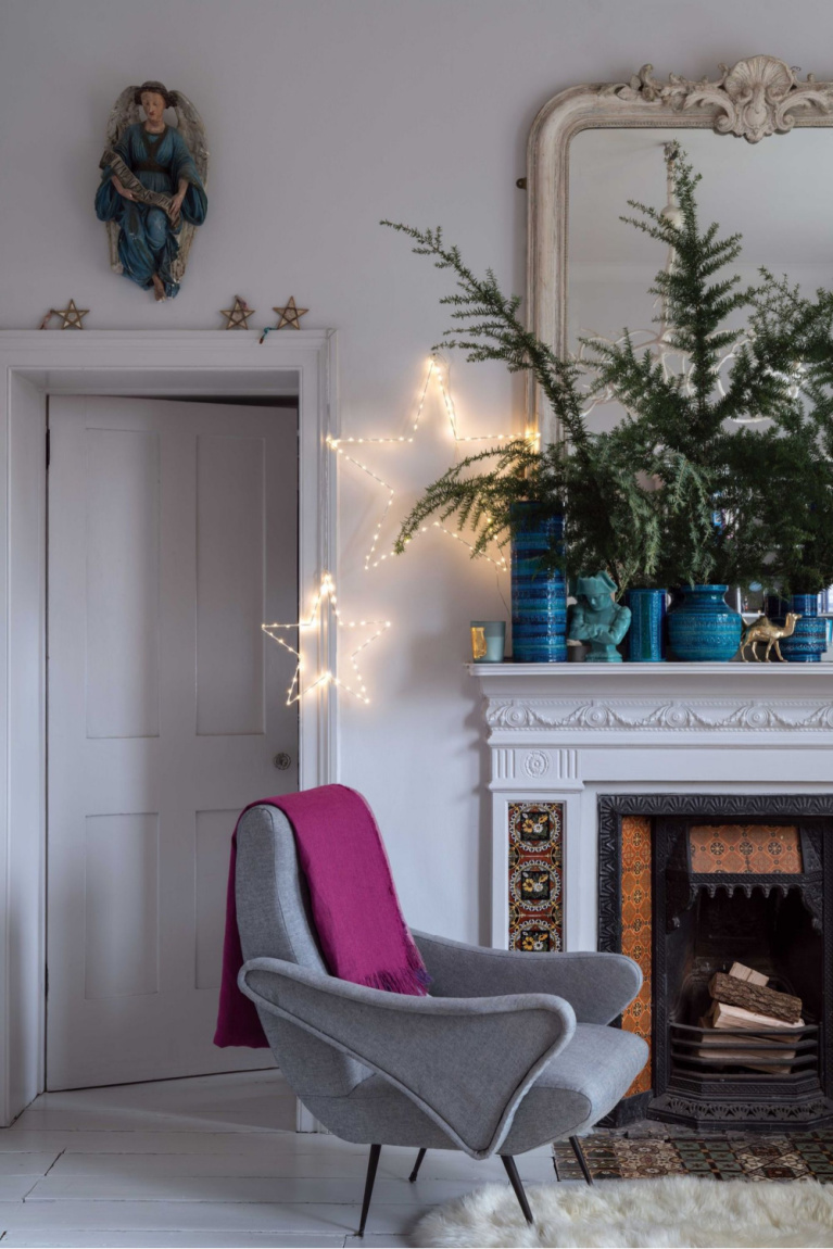 French country Christmas decorated living room with fireplace and blue accents - Farrow & Ball. #frenchcountry #christmasdecor #bluechristmas #frenchchristmas