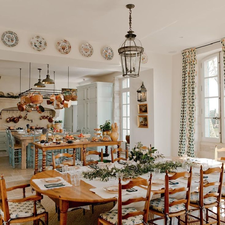 French farmhouse kitchen and dining area in a Provence chateau ( light blue cabinets and copper pots from E. Dehllerin) - @provencepoirers. #frenchkitchen #frenchfarmhouse #frenchchateau #copperpots #frenchfarmhousekitchen #lightblue #provencekitchen #provencepoirers