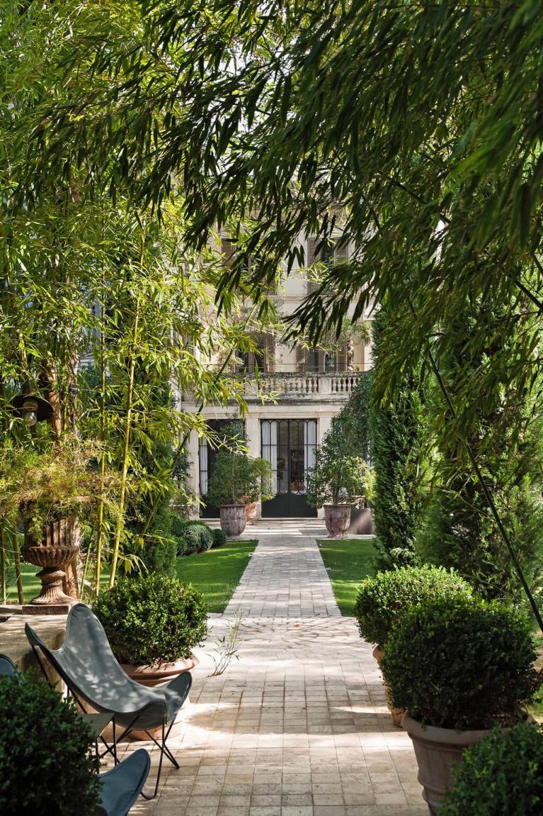 Enchanting manicured gardens and paths on the grounds or the romantic Avignon Hôtel Particulier, a restored 19th century mansion in the heart of Avignon’s historic center - Haven In. #frenchgarden #chateaugarden #frenchchateau #provence #frenchcountry #restoredchateau #southoffrance #aivgnonhotel #gardens