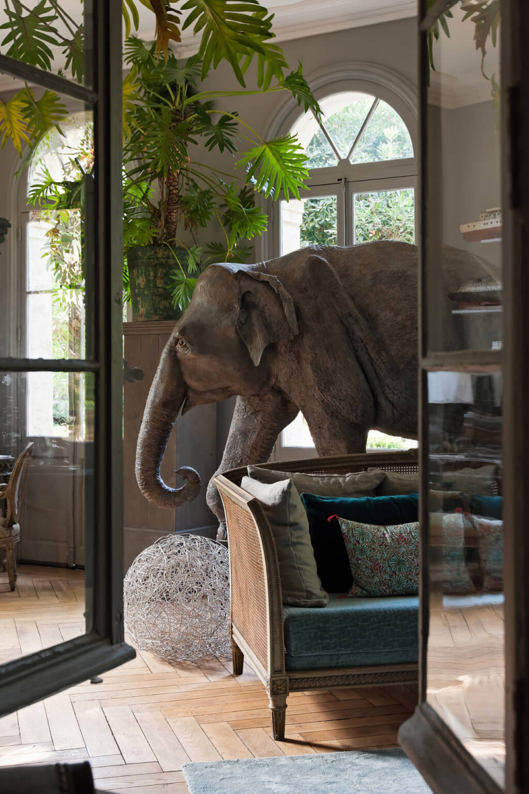 Eclectic and dramatic art collection including lifesize elephant in Avignon Hôtel Particulier, a beautifully restored 19th century mansion in the heart of Avignon’s historic center - Haven In. #modernfrench #frenchcountrydecor #frenchchateau #provence #frenchcountry #restoredchateau #southoffrance #aivgnonhotel