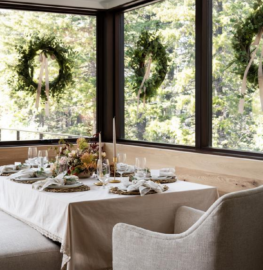 Natural and serene Christmas holiday table with wreaths on window and fall floral centerpiece - McGee & Co. #holidaytable