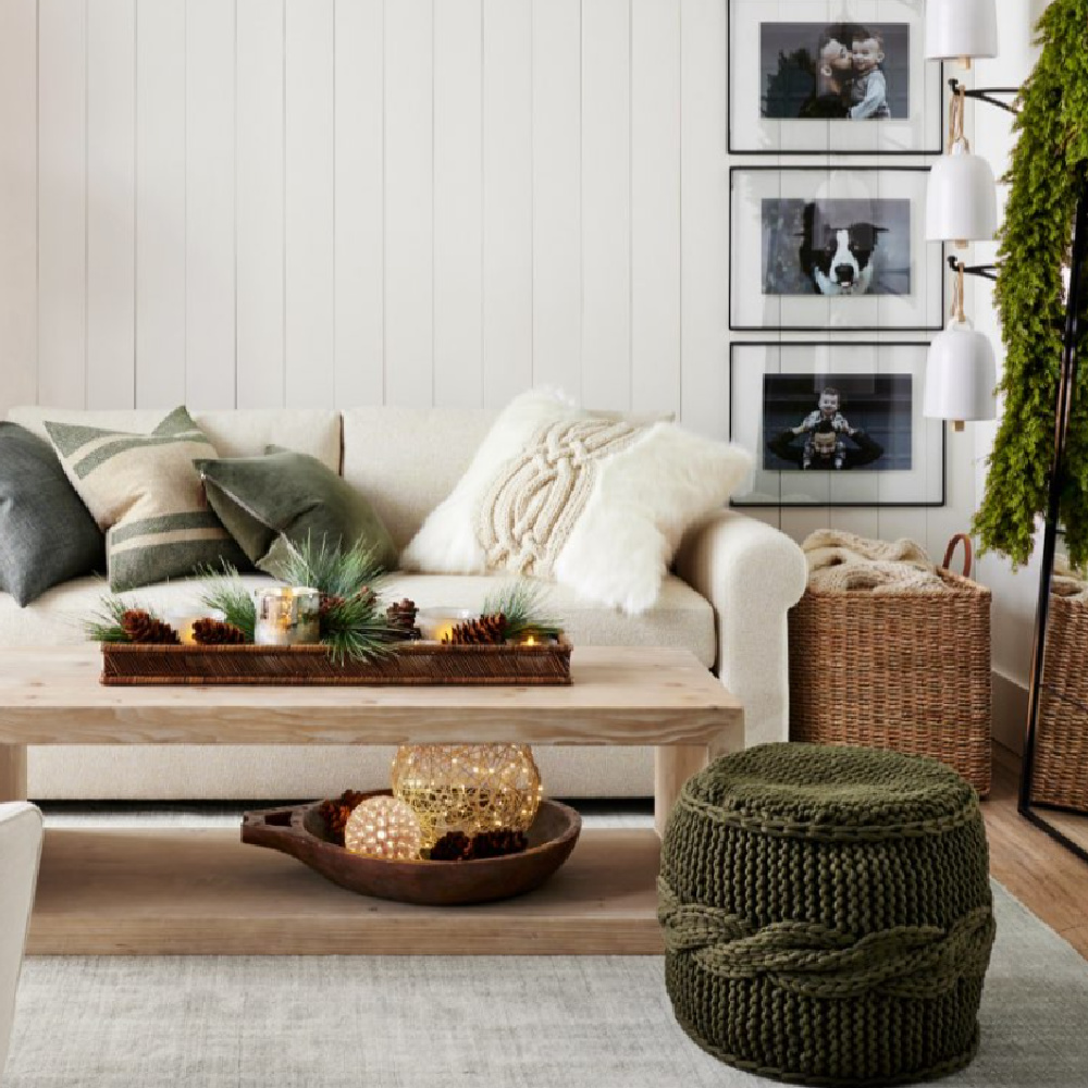 Green accents in a laid back and natural family room - Pottery Barn. #holidaydecor #greenandwhite #naturalchristmas