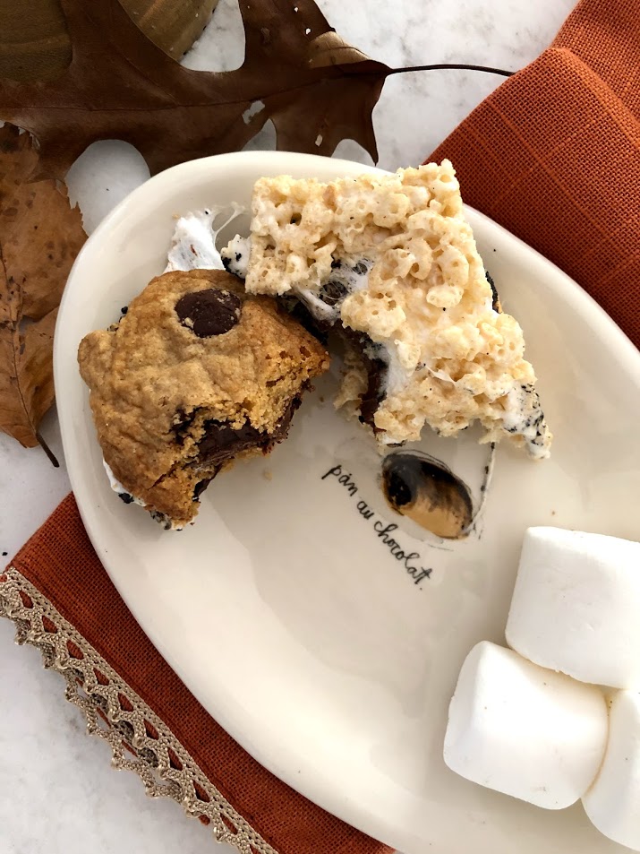 Who needs graham crackers when rice krispy treats and cookies work just fine for s'mores? #hellolovelystudio #gfreesmores #smoreweather #roastedmarshmallows #fallvibes