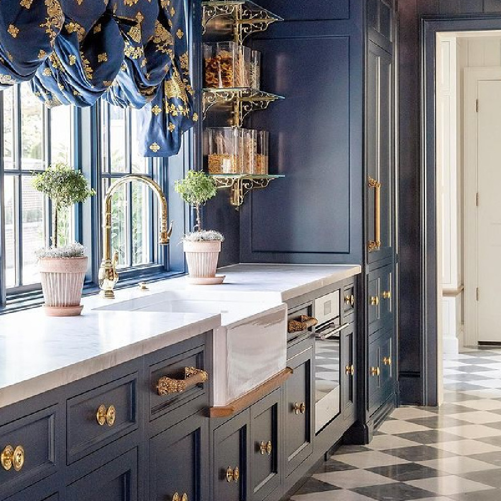 Navy blue kitchen by The Fox Group with bold brass eleegant hardware. #bluekitchencabinets