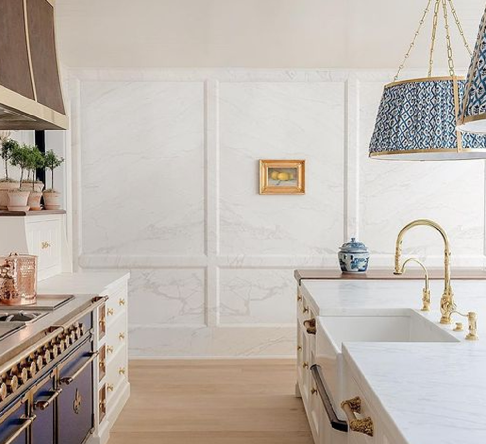 Elegant and timeless kitchen with blue accents and innovative use of marble - design by The Fox Group. #timelesskitchens #bespokedesign #frenchkitchens