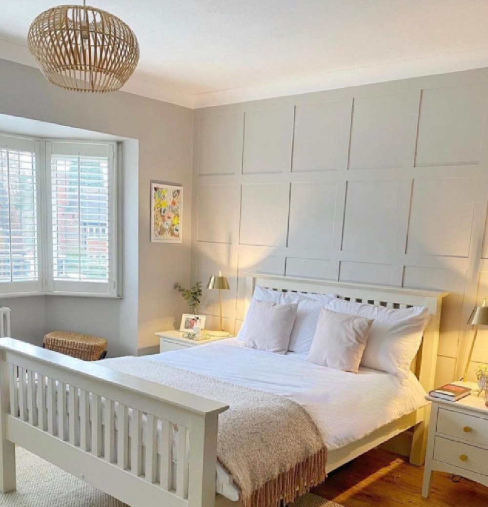 Cornforth White (Farrow & Ball) paint color on paneled wall of a serene bedroom by @_houseonthemeadow