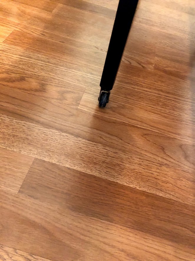 Detail of Gladstone Oak laminate flooring in a condo renovation.