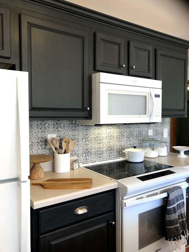 The backsplash tile in this condo kitchen only looks handmade and expensive - come see how we tackled the project on a budget.