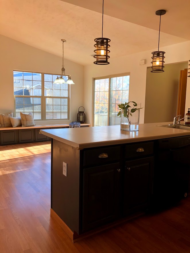 A custom window seat in the dining room was constructed with the salvaged kitchen cabinets - painted Sherwin Williams Carbonized.