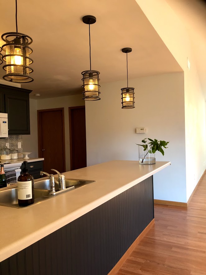 What a difference adding beadboard paneling to the breakfast bar made! I painted it #sherwinwilliamscarbonized. 